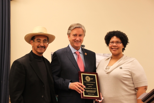 Photo by Ayrianne Parks, AFOPAFOP president Jesús Gamboa and Massachusetts board member Leida Cartegena present the award to Congressman John Tierney.